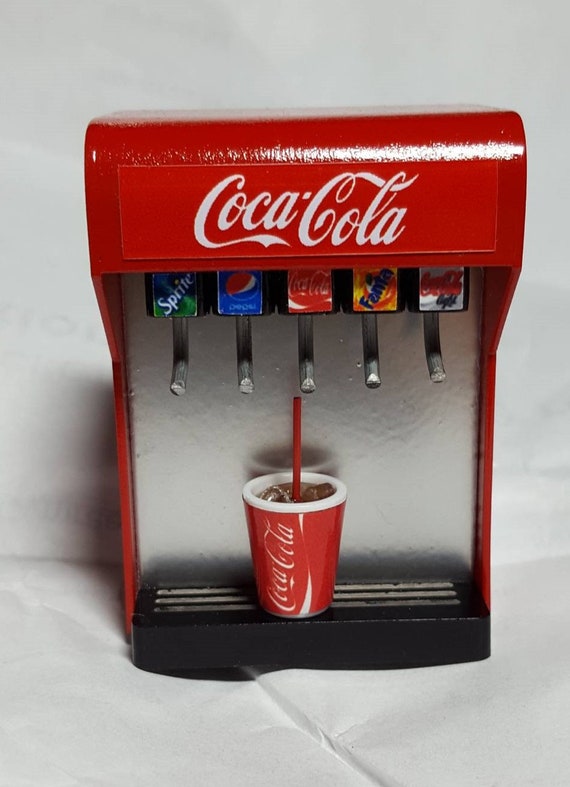 Illustrative example of miniature soda vending machine